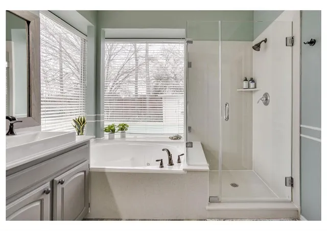 a bathroom with a bathtub and a sink