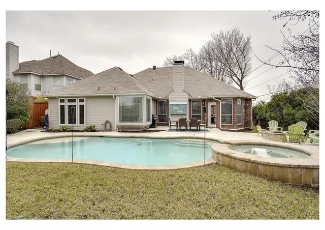 a view of a house with pool table and chairs
