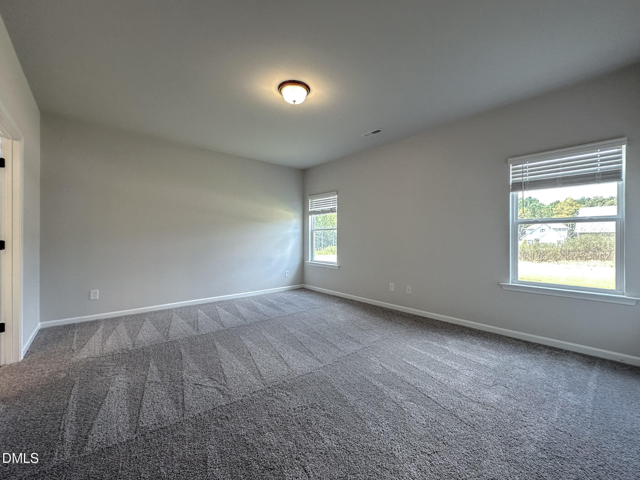 337 White Azalea Way Benson, NC 27504 - Photo 18 of 35 an empty room with a window