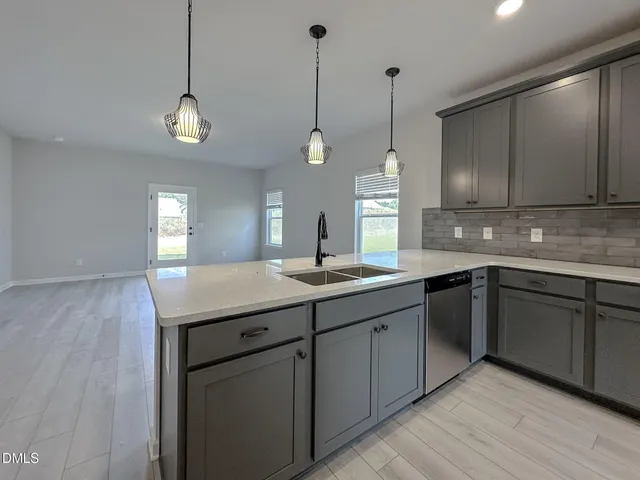 a kitchen with sink and microwave