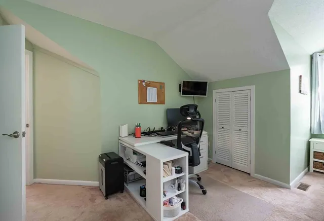 a view of a workspace with furniture