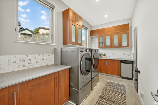 14902 Saddle Leaf Court Draper, UT 84020 - Photo 19 of 52 Main Floor Laundry area featuring washer and dryer and cabinet space
