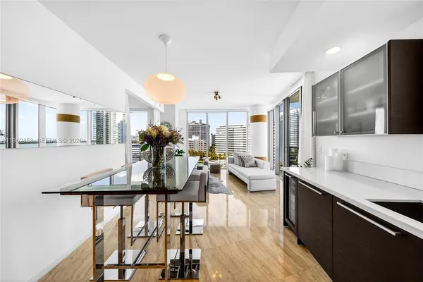a view of a kitchen and dining room