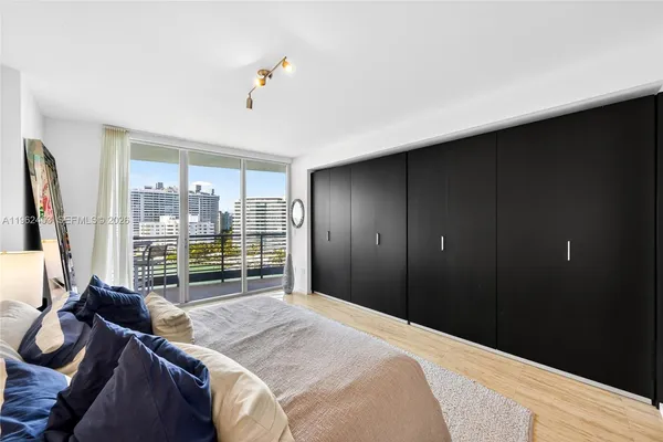 a bed room with a bed and a night stand