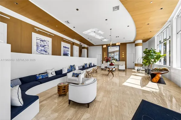 a living room with furniture and gym equipment