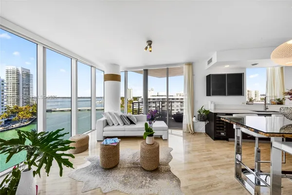 a kitchen with a large counter top furniture and a potted plant