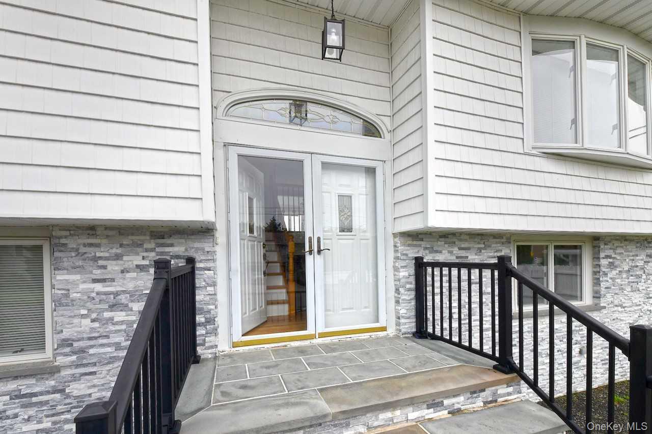 107 Beverly Road Massapequa, NY 11758 - Photo 3 of 41 a view of a house with a porch