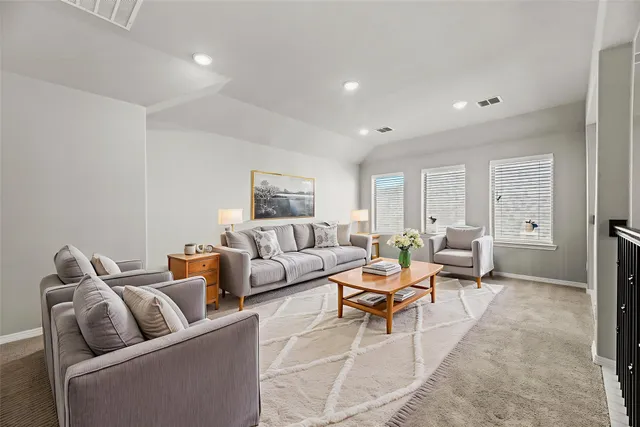 a living room with furniture and a couch