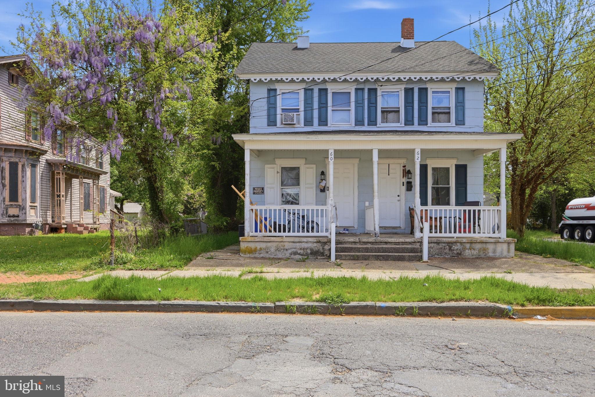 60 Walnut Street Salem, NJ 08079 - Photo 3 of 25 a front view of a house with a yard