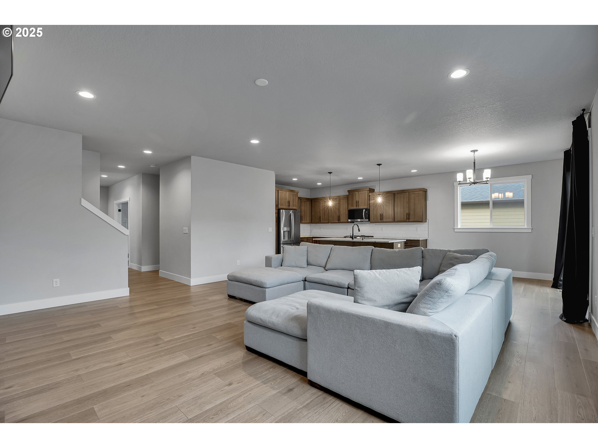 38249 Mulberry Street Sandy, OR 97055 - Photo 12 of 44 a living room with furniture and a wooden floor