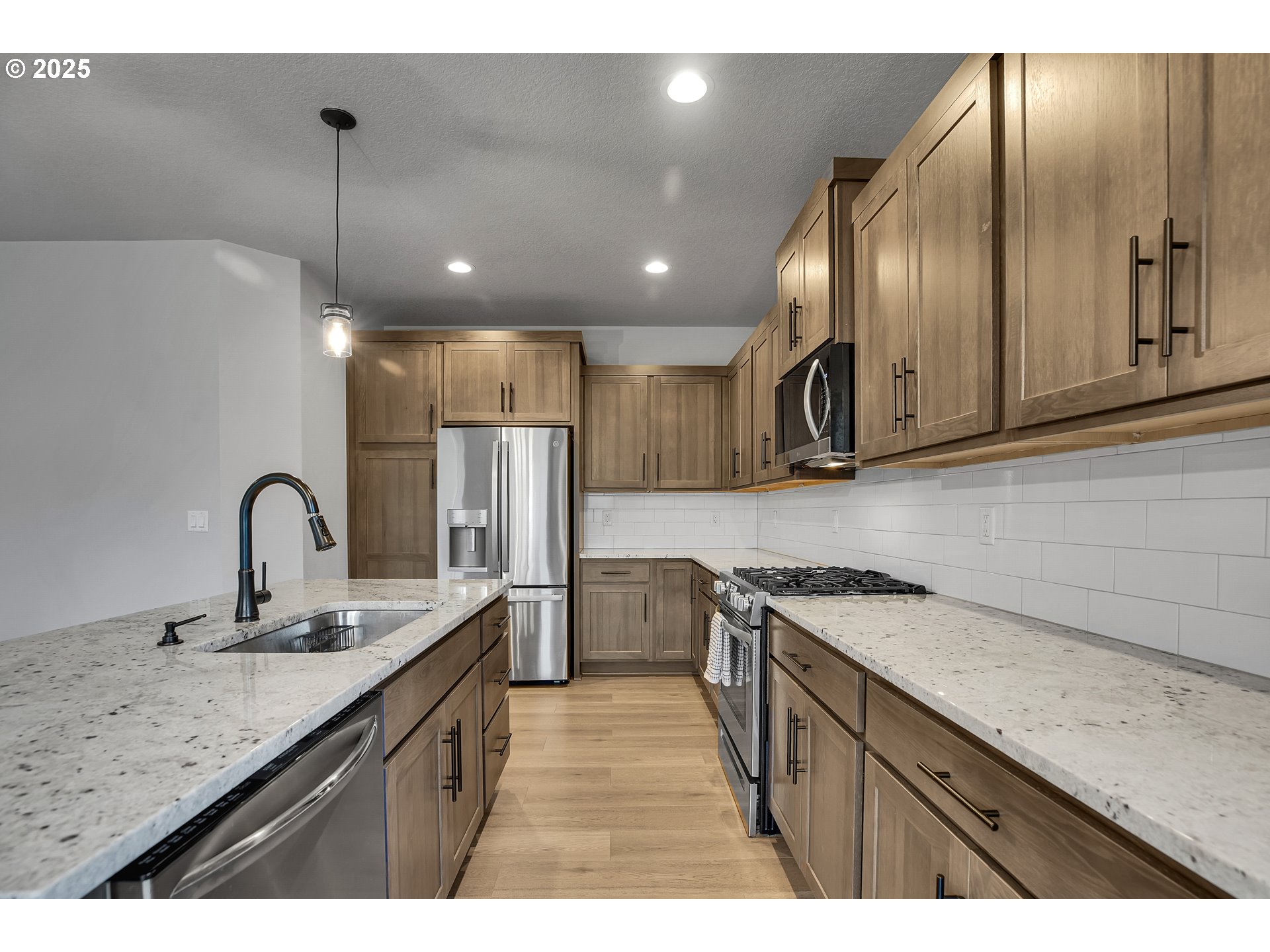 38249 Mulberry Street Sandy, OR 97055 - Photo 18 of 44 a kitchen with a sink stainless steel appliances and cabinets