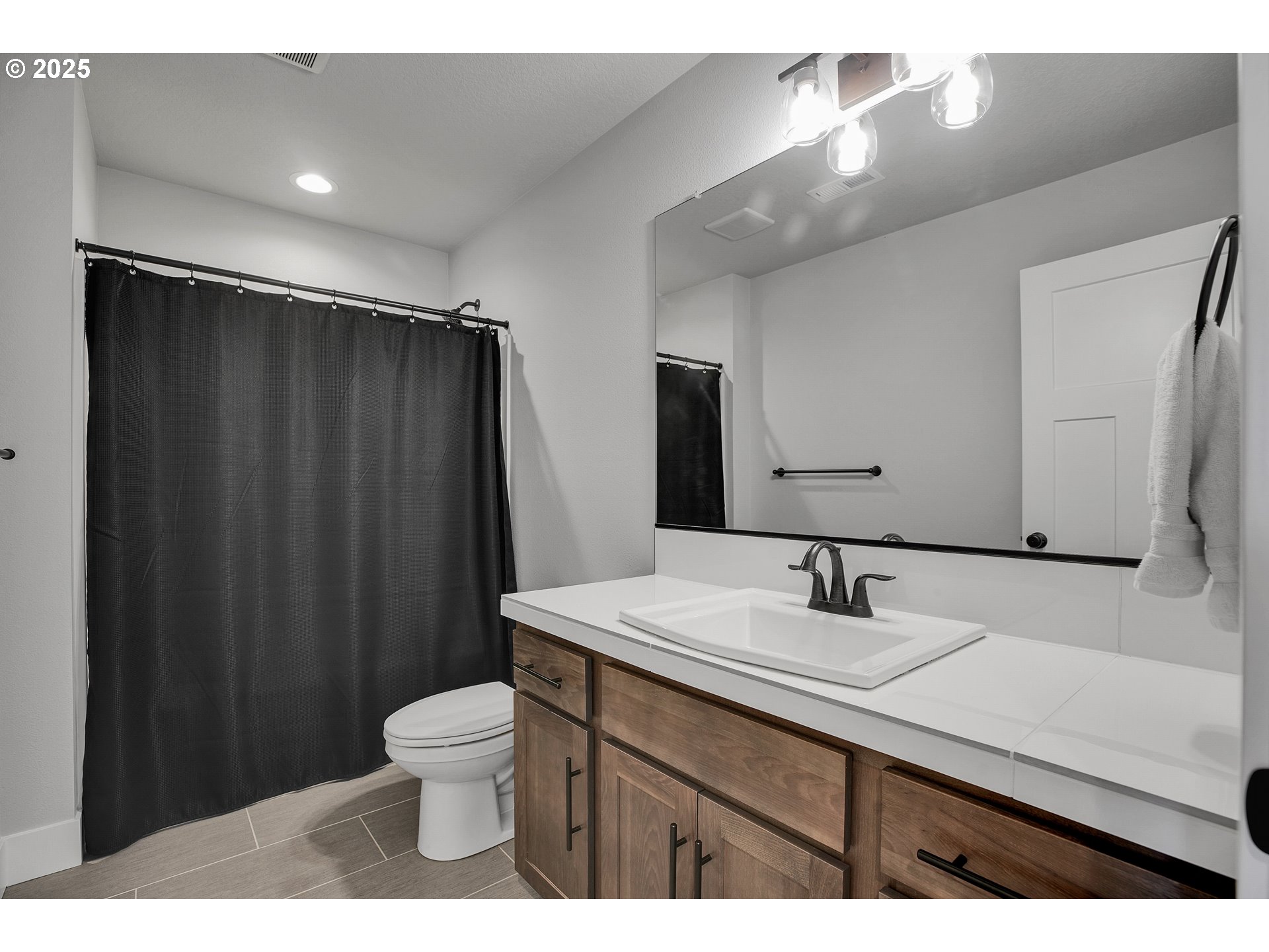 38249 Mulberry Street Sandy, OR 97055 - Photo 32 of 44 a bathroom with a double vanity sink toilet and a mirror