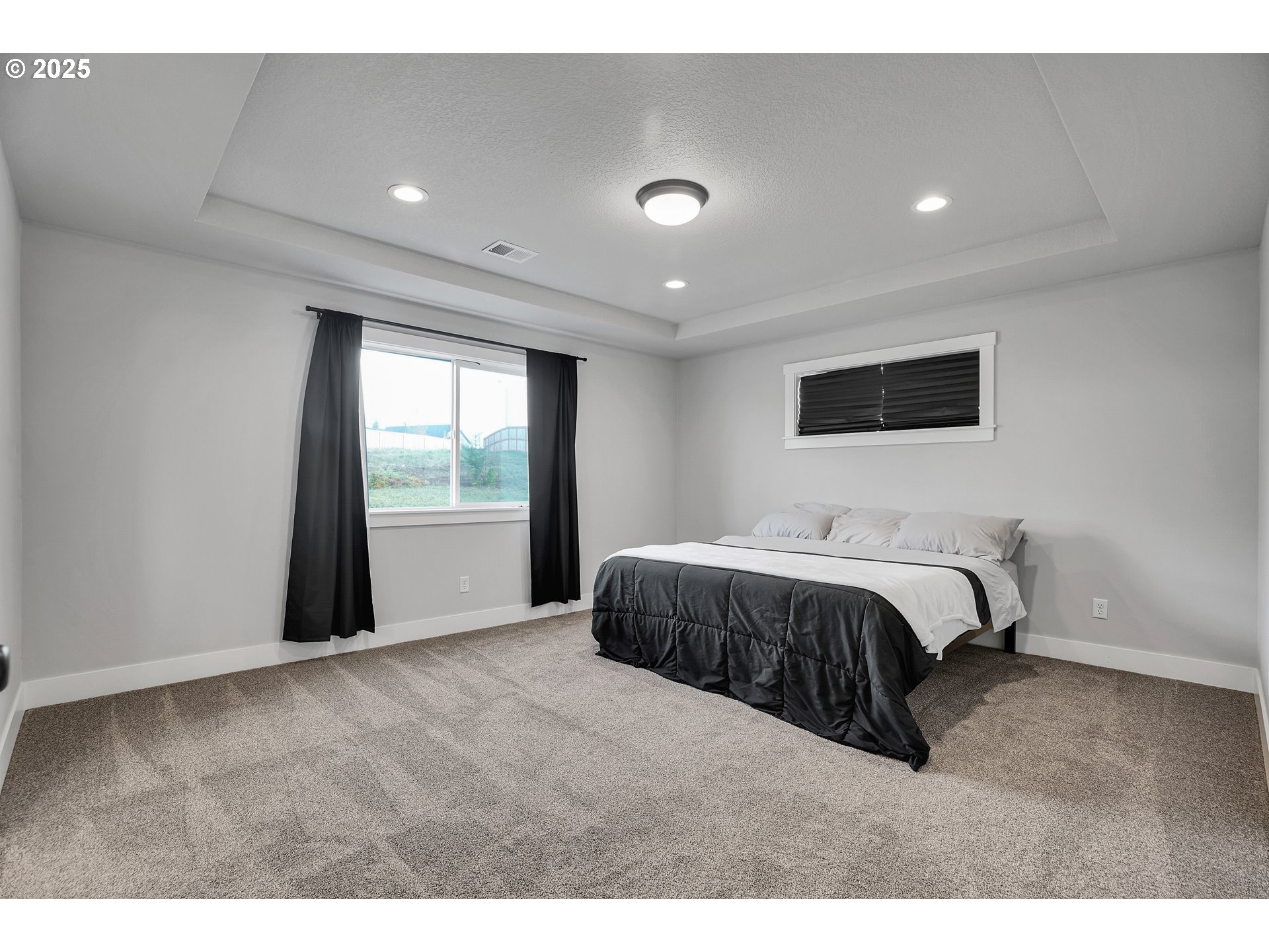 38249 Mulberry Street Sandy, OR 97055 - Photo 33 of 44 a spacious bedroom with a large bed and a window