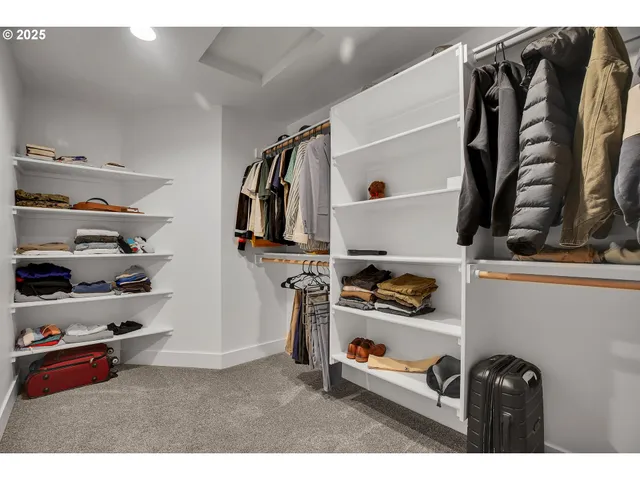 a utility room with multiple dryer and washer