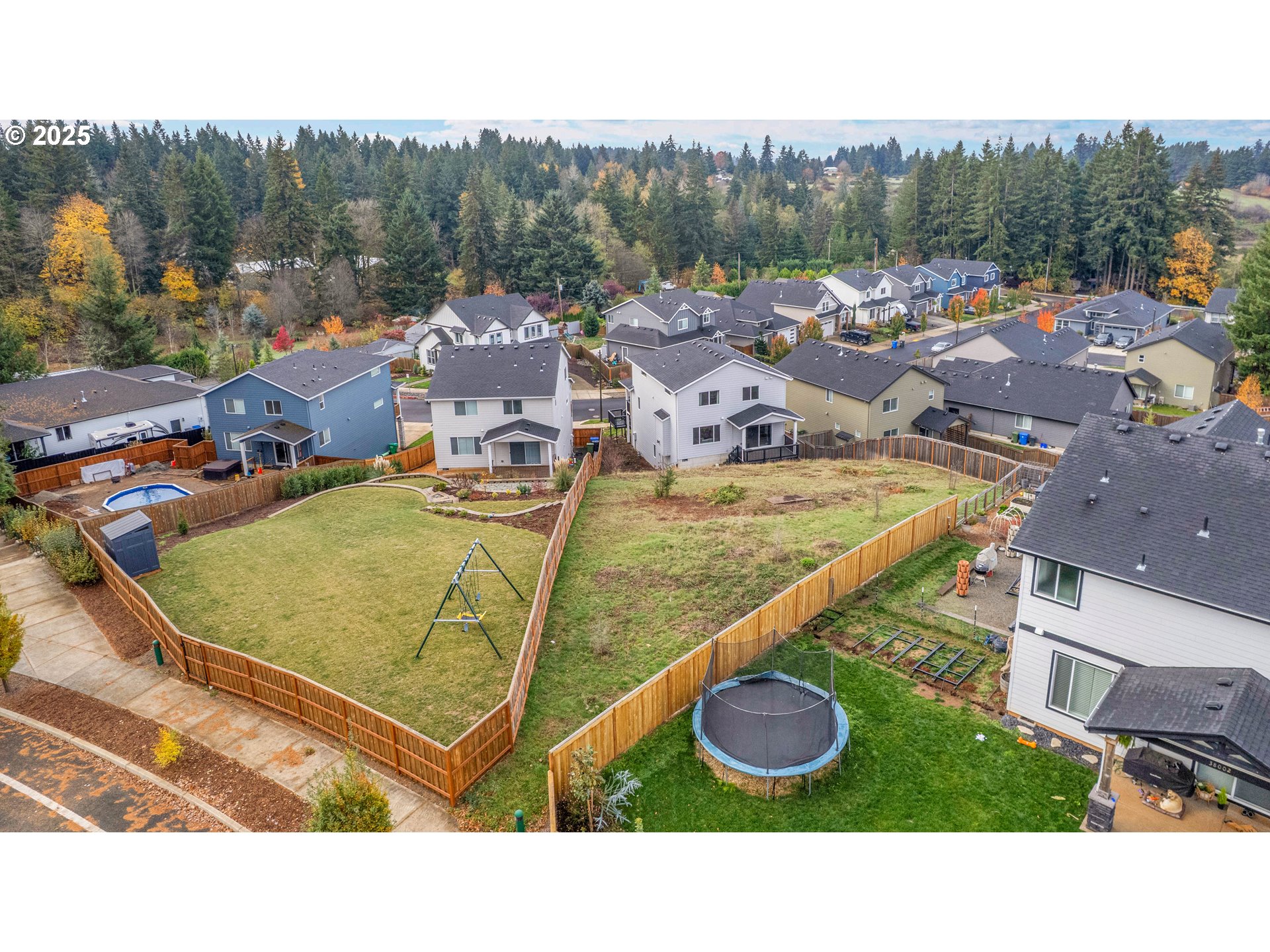 38249 Mulberry Street Sandy, OR 97055 - Photo 44 of 44 a view of a swimming pool with a patio and yard