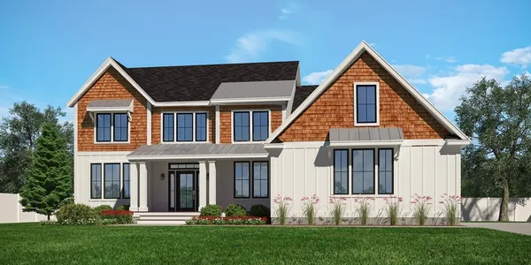 a front view of a house with a yard and garden