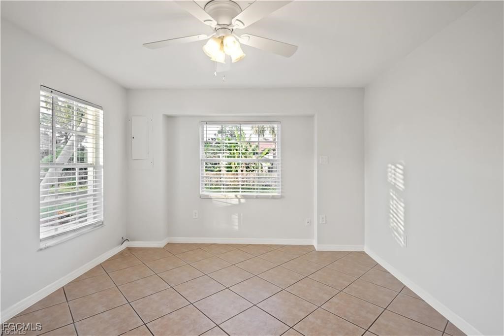260 13th Street Southwest Naples, FL 34117 - Photo 8 of 13 a view of an empty room with a window