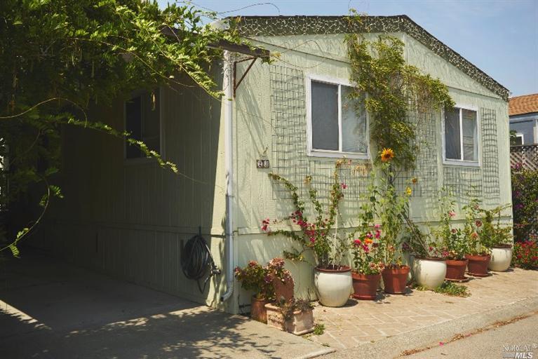 23 Yosemite Road, Unit 23 San Rafael, CA 94903 - Photo 1 of 1 a view of a balcony with chair and potted plants