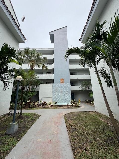 8335 Southwest 152nd Avenue, Unit PH2 Miami, FL 33193 - Photo 18 of 19 a view of outdoor space with seating area