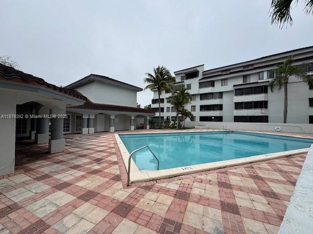 8335 Southwest 152nd Avenue, Unit PH2 Miami, FL 33193 - Photo 19 of 19 a view of house with a swimming pool