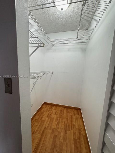 8335 Southwest 152nd Avenue, Unit PH2 Miami, FL 33193 - Photo 5 of 19 a view of a room with wooden floor