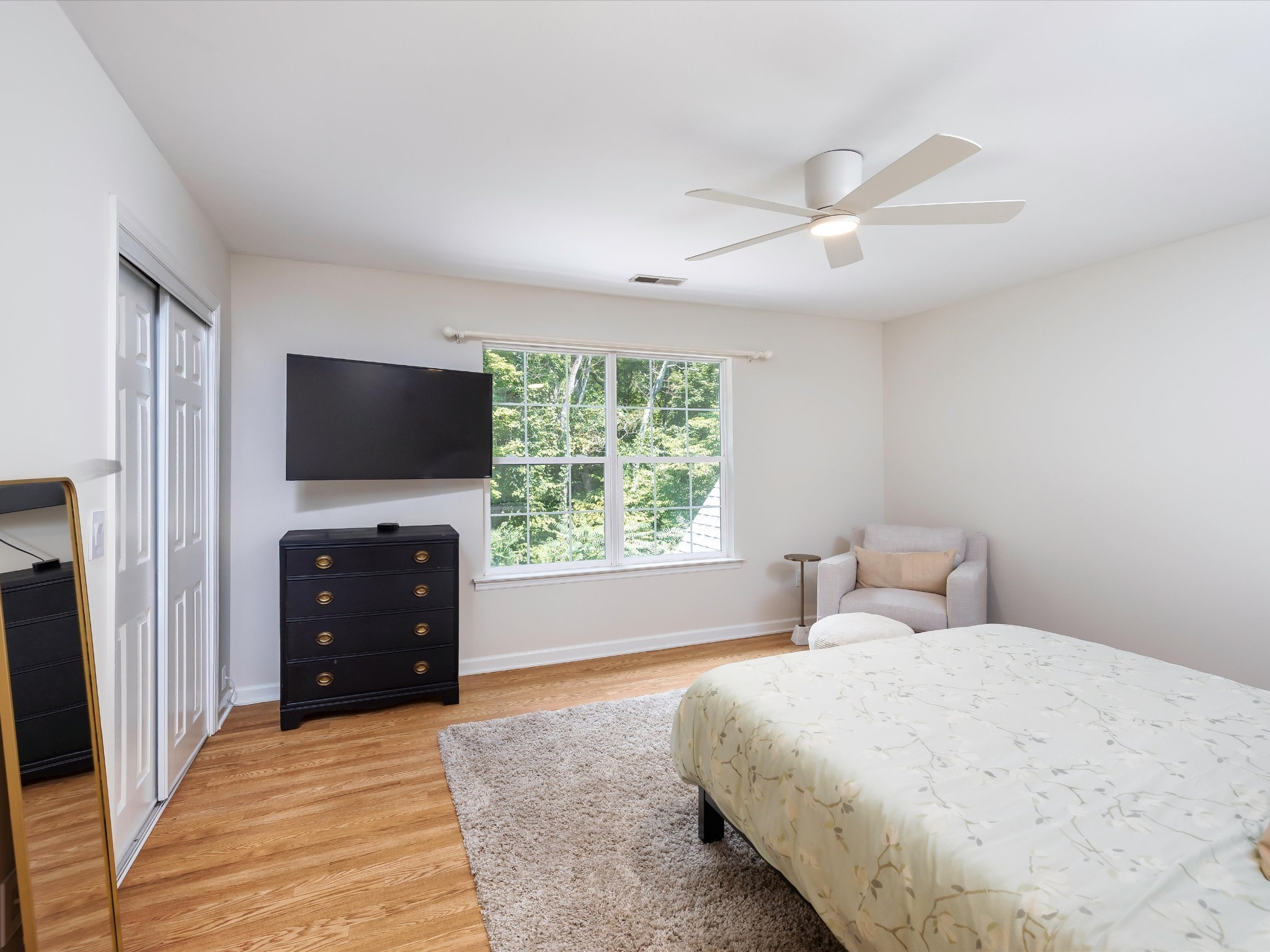 6480 Peytonsville-Arno Road College Grove, TN 37046 - Photo 46 of 96 a spacious bedroom with a bed and a flat screen tv