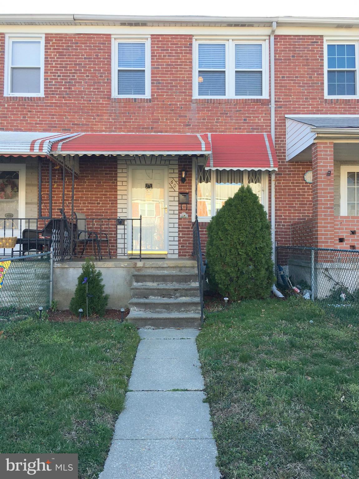 60 Wiltshire Road Baltimore, MD 21221 - Photo 1 of 1 a front view of a brick house with a yard