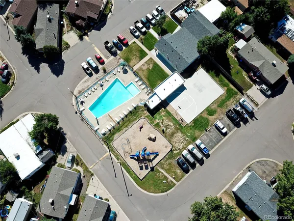 an aerial view of a house a yard and outdoor seating
