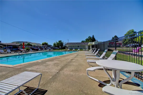 a view of a patio with swimming pool