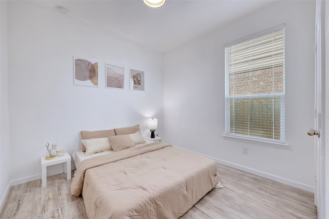 468 Sheepshank Drive Georgetown, TX 78633 - Photo 19 of 27 a bedroom with a bed and a window