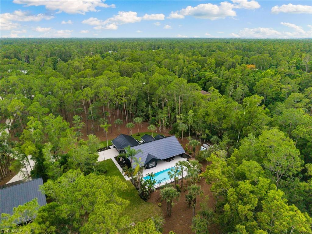 4521 3rd Avenue Northwest Naples, FL 34119 - Photo 44 of 46 an aerial view of a house with a yard