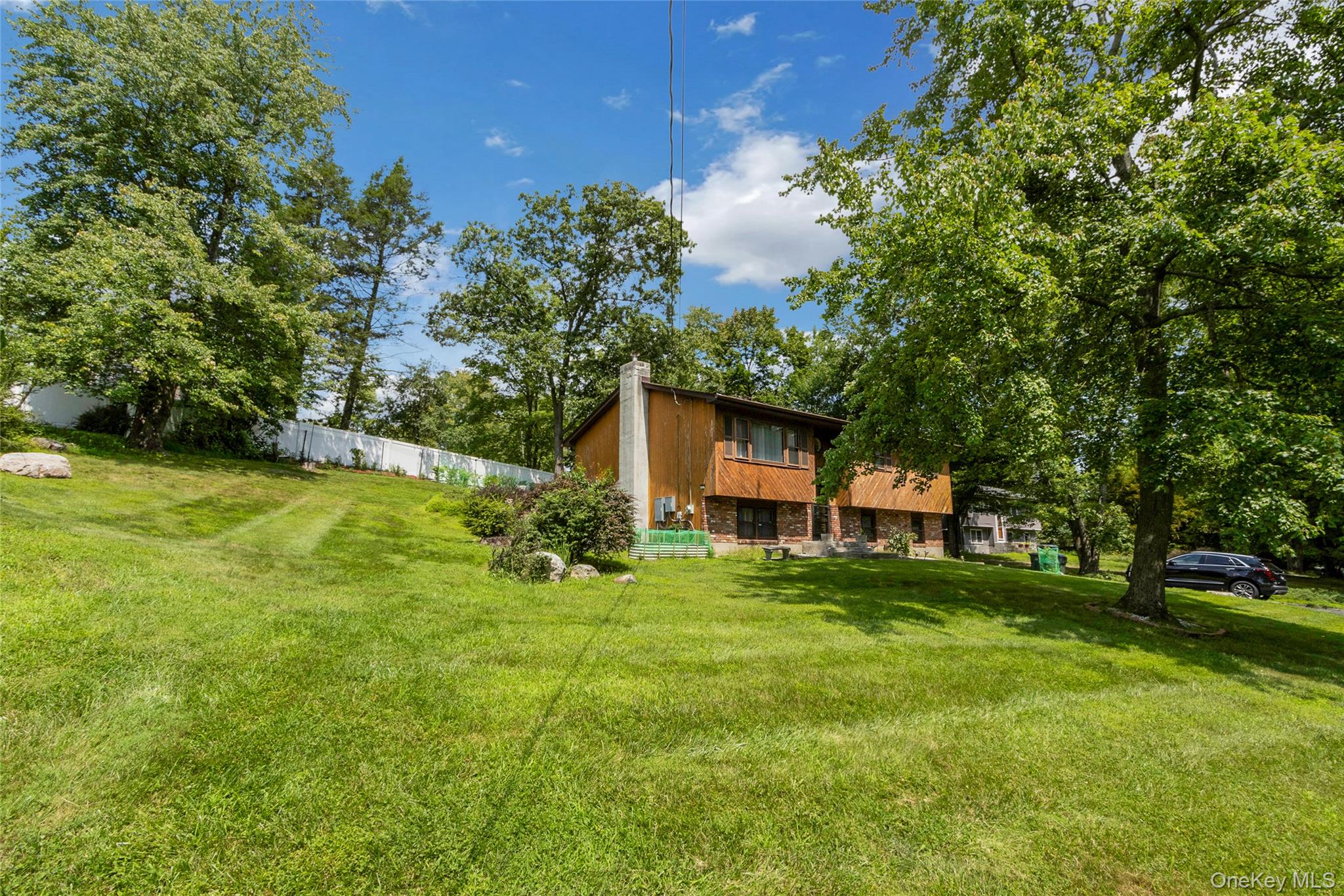 74 Heaton Road Monroe, NY 10950 - Photo 2 of 22 Note the white fence along the property line flanked by newly planted trees