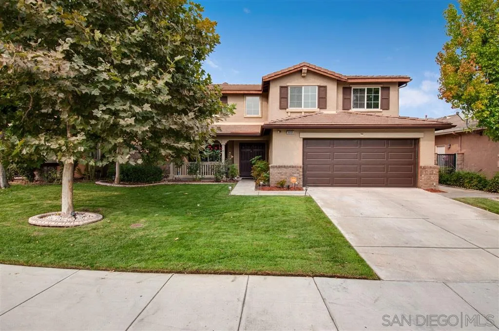 38305 Encanto Road Murrieta, CA 92563 - Photo 1 of 24 a front view of a house with a yard