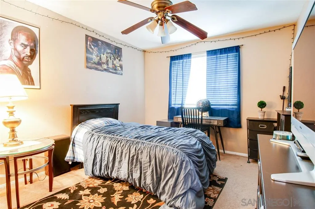38305 Encanto Road Murrieta, CA 92563 - Photo 14 of 24 a bedroom with a bed and wooden floor