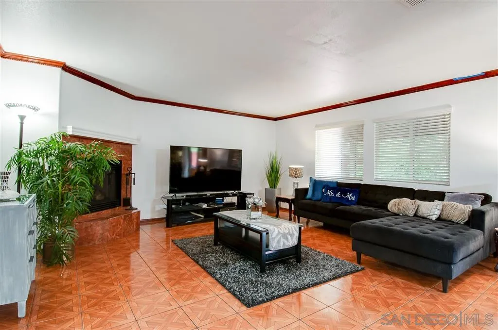 38305 Encanto Road Murrieta, CA 92563 - Photo 19 of 24 a living room with furniture and a flat screen tv