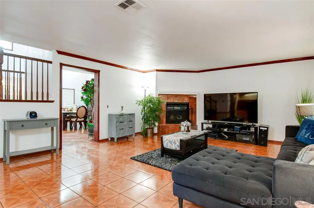 38305 Encanto Road Murrieta, CA 92563 - Photo 20 of 24 a living room with furniture and a flat screen tv