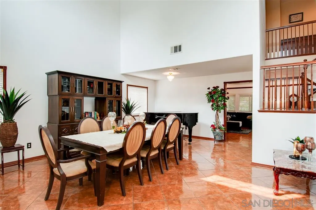 38305 Encanto Road Murrieta, CA 92563 - Photo 24 of 24 a dining room with furniture a rug and wooden floor