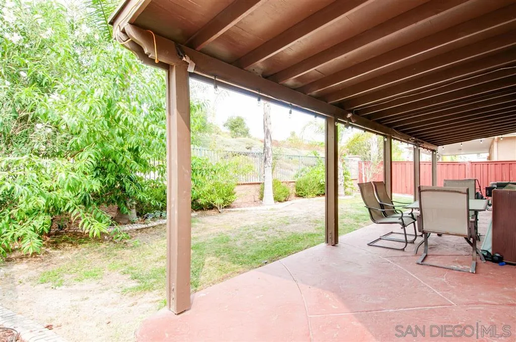 38305 Encanto Road Murrieta, CA 92563 - Photo 3 of 24 a view of a porch with chairs and backyard