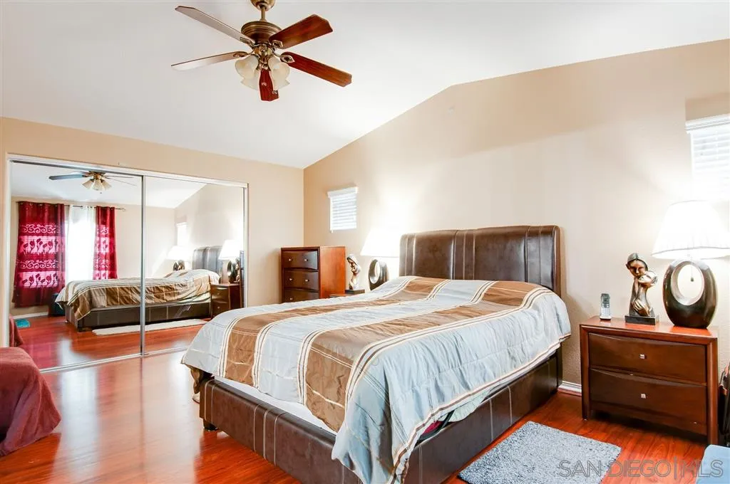38305 Encanto Road Murrieta, CA 92563 - Photo 6 of 24 a bedroom with a bed and a chandelier