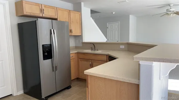 a kitchen with stainless steel appliances a refrigerator and a sink