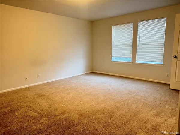 an empty room with a windows