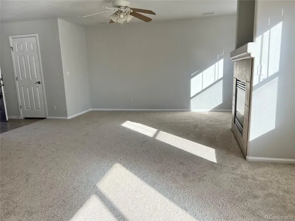 a view of a big room with windows