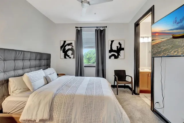 a bedroom with a bed and a table