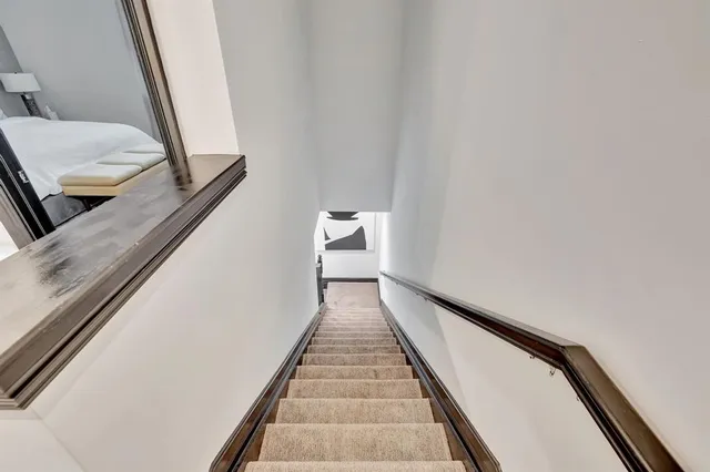 a view of a hallway with staircase
