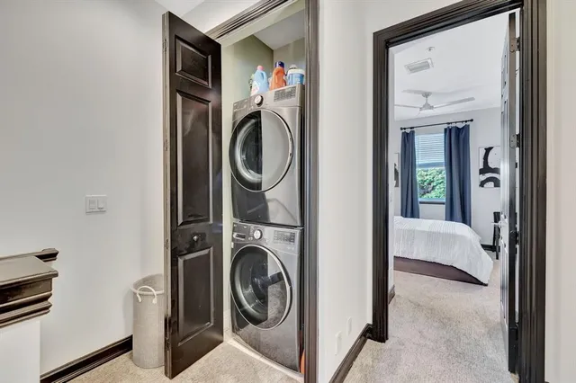 a view of a hallway with washer and dryer