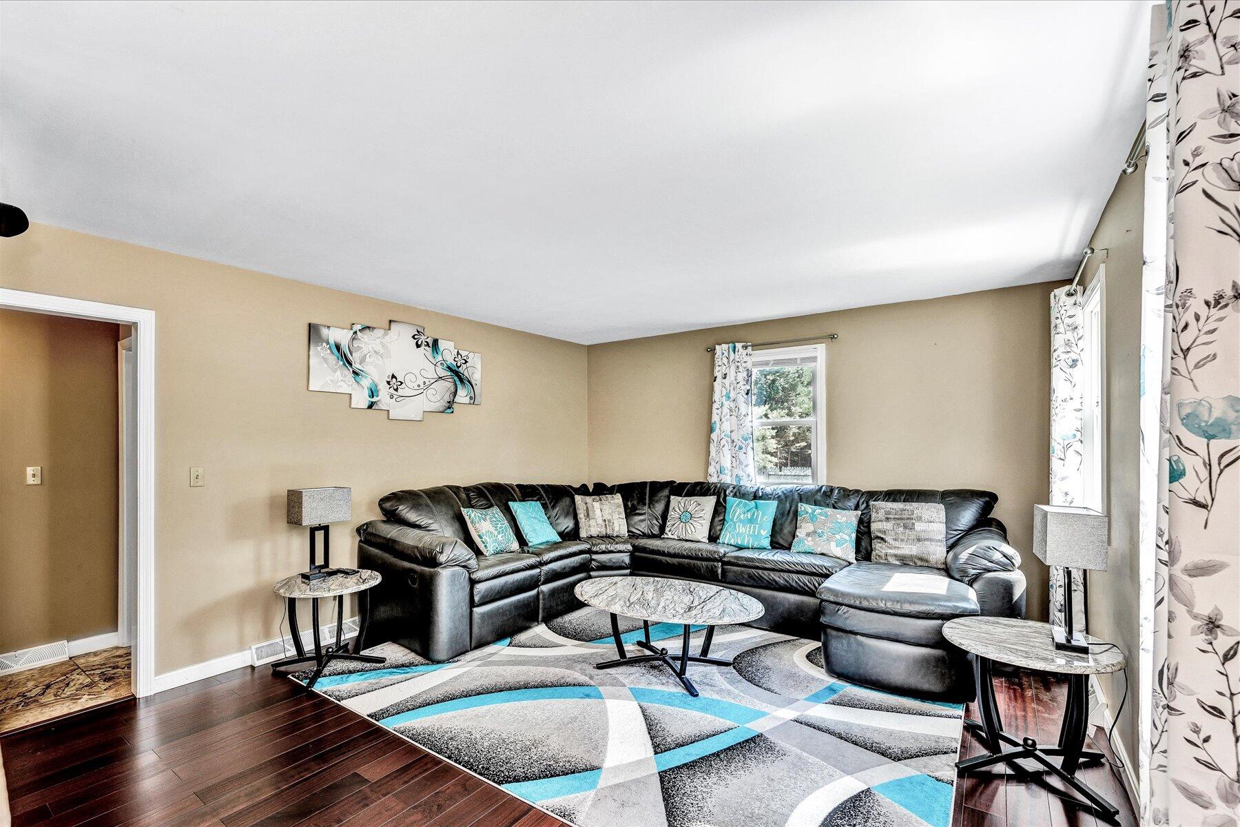 127 South Sandwich Road Mashpee, MA 02649 - Photo 16 of 55 a living room with furniture and a wooden floor