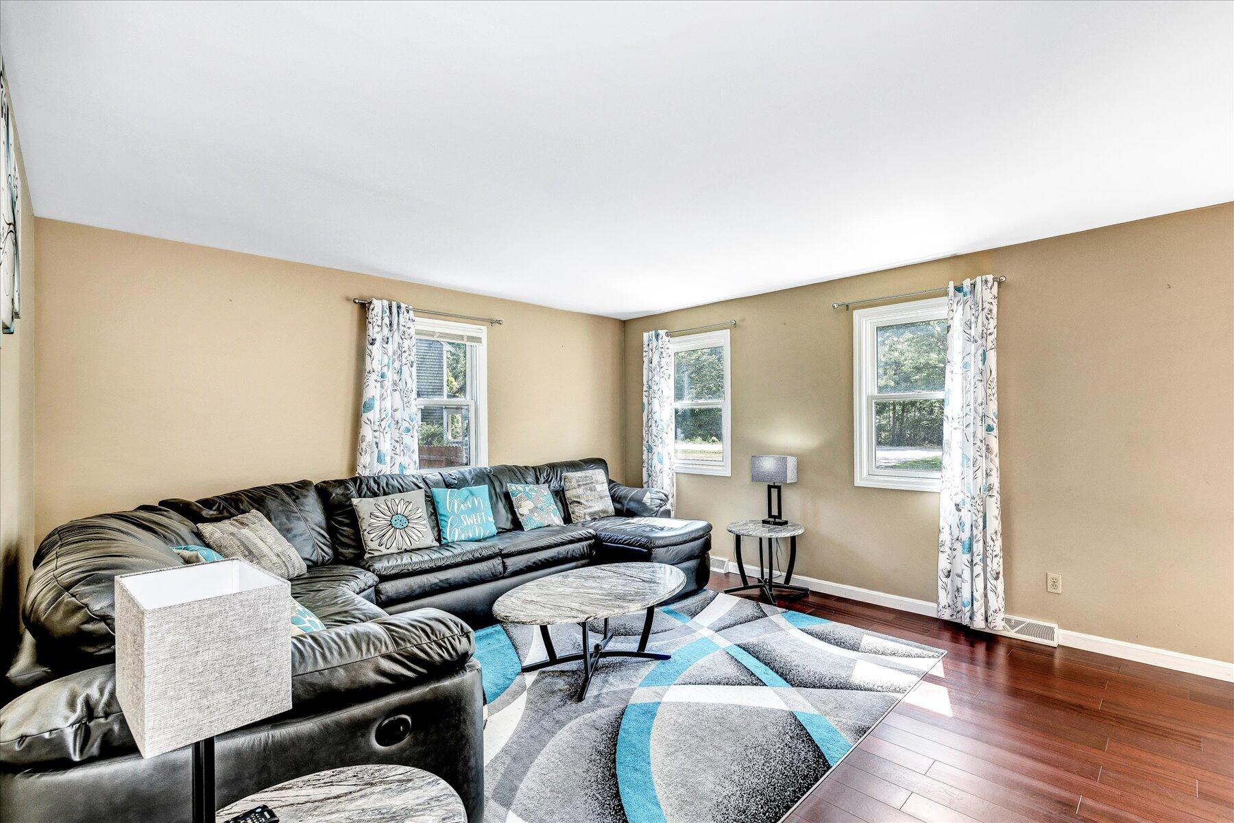127 South Sandwich Road Mashpee, MA 02649 - Photo 17 of 55 a living room with furniture and wooden floor