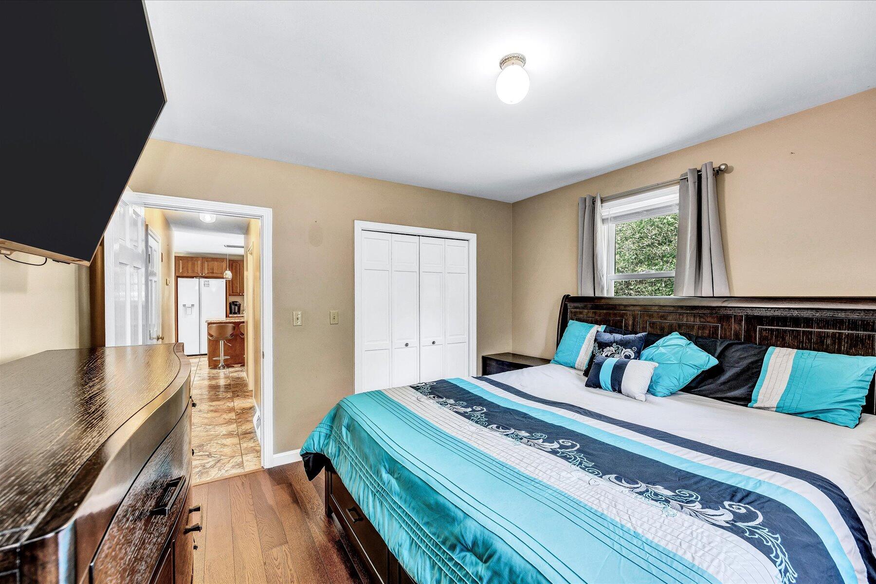 127 South Sandwich Road Mashpee, MA 02649 - Photo 19 of 55 a bedroom with bed and wooden floor