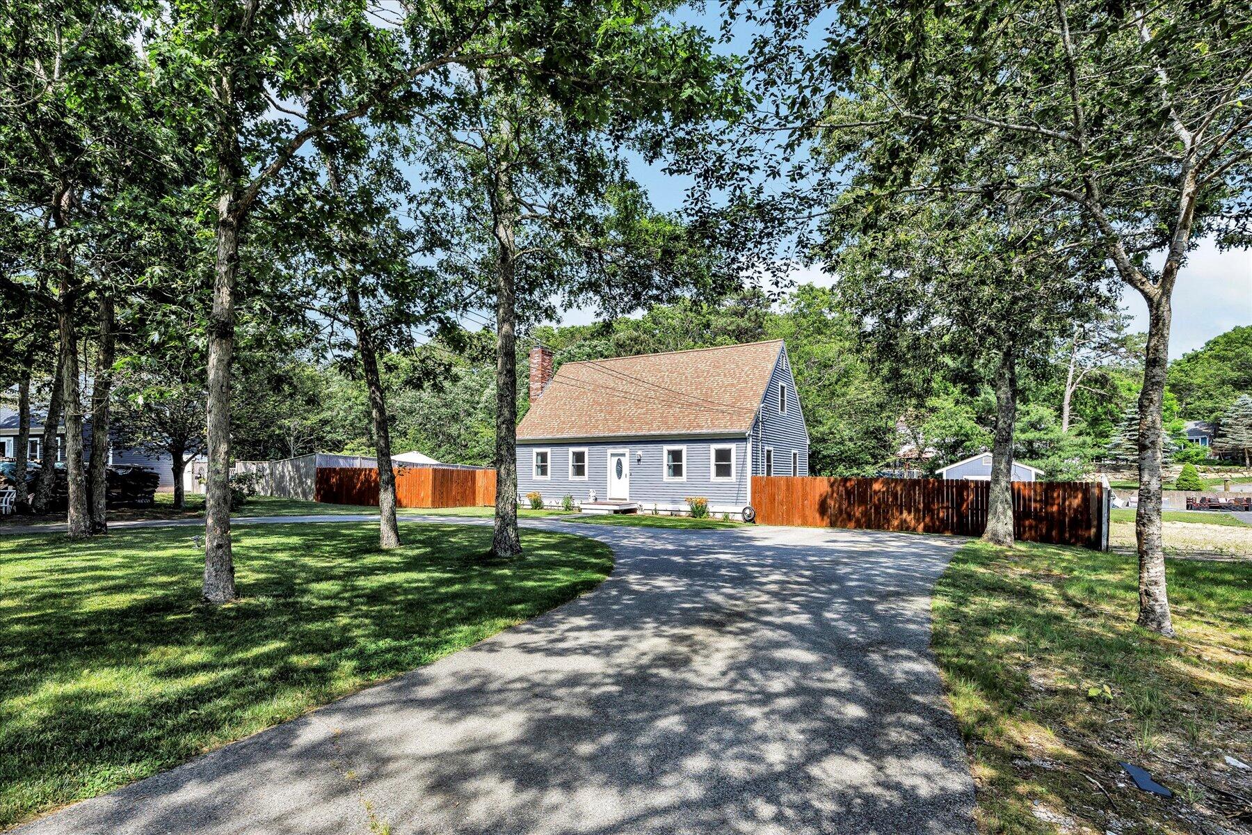 127 South Sandwich Road Mashpee, MA 02649 - Photo 3 of 55 front view of a house with a yard