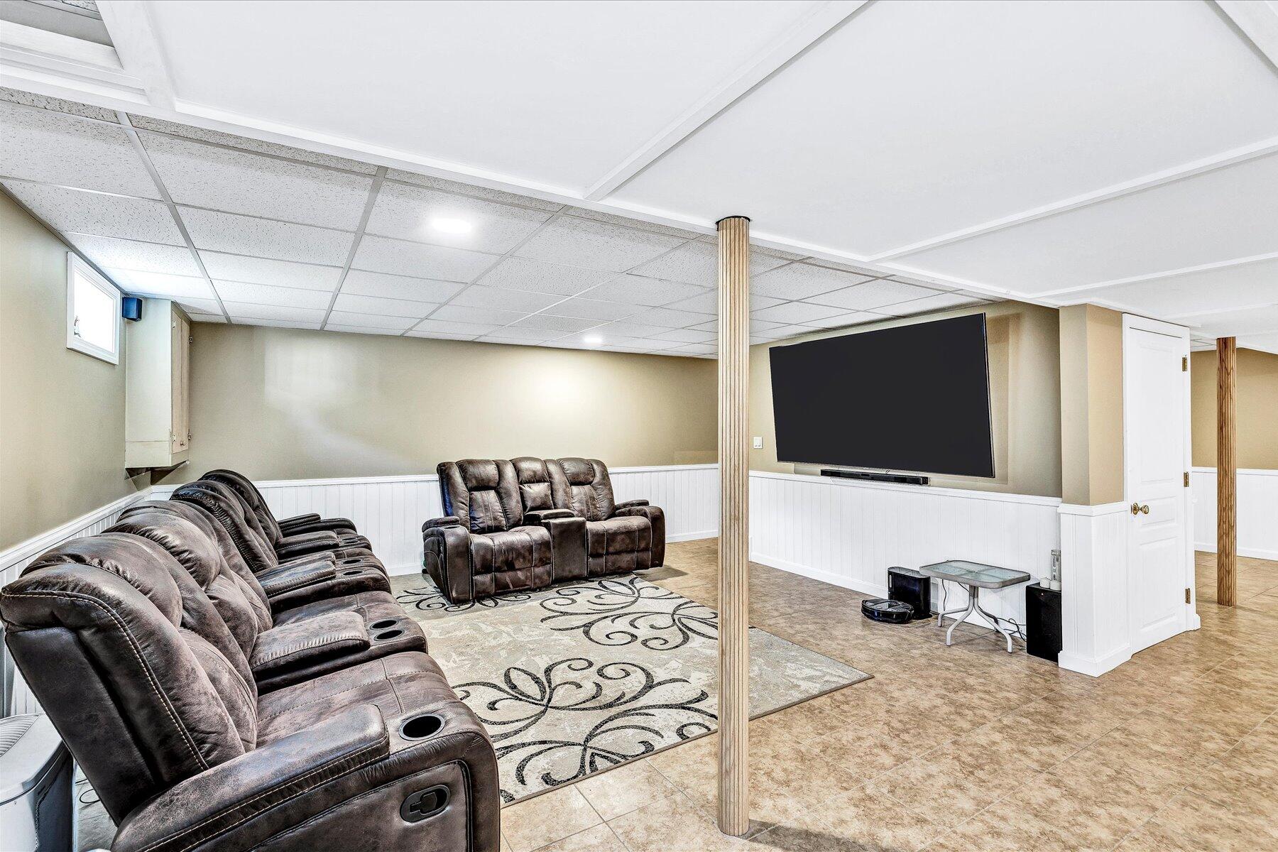 127 South Sandwich Road Mashpee, MA 02649 - Photo 33 of 55 a living room with furniture and a flat screen tv